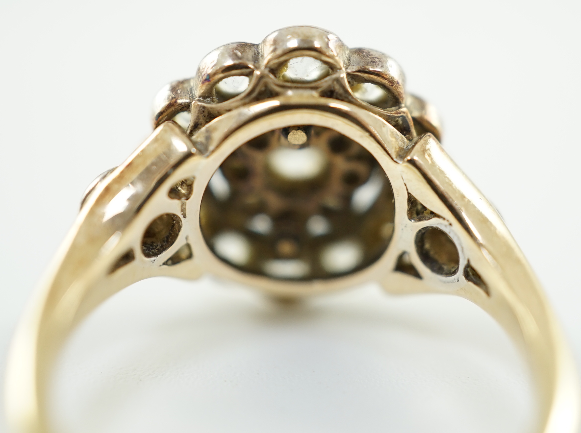 A mid 20th century gold and millegrain set diamond cluster target ring